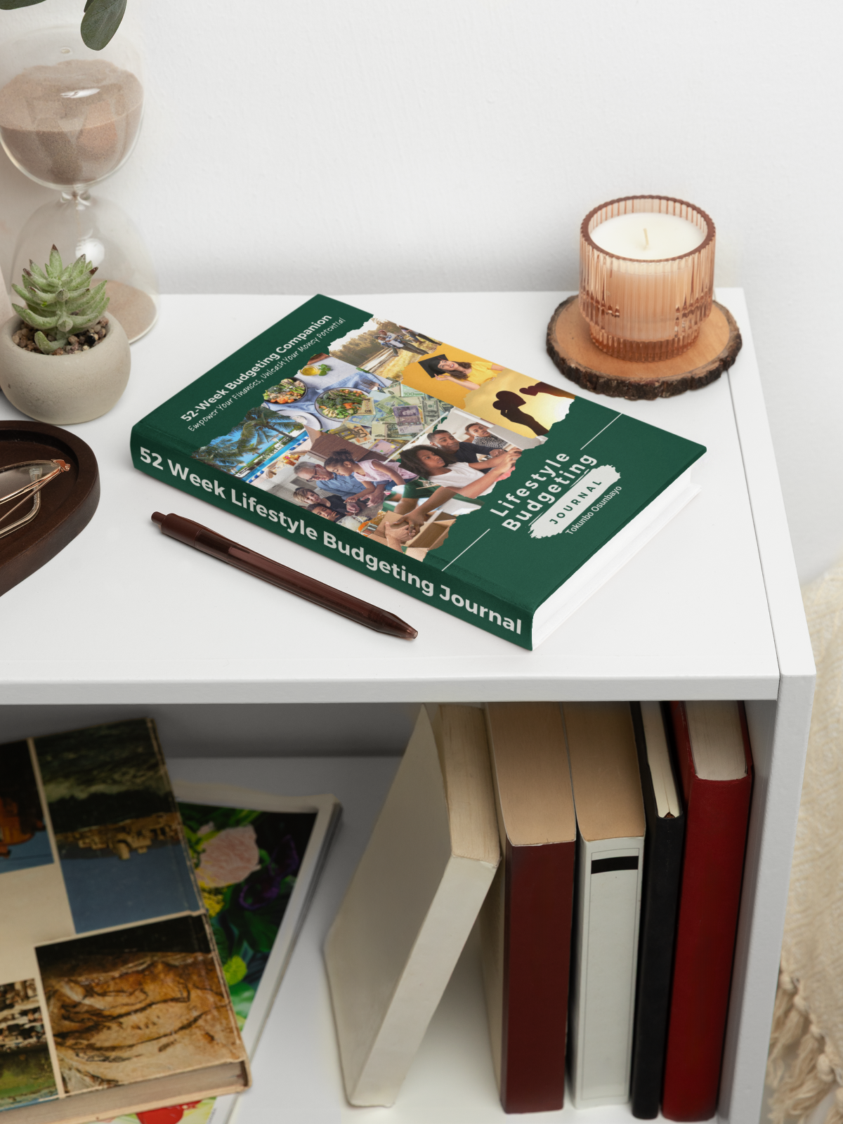 Journal on table with candle and pen